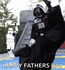 a man dressed as darth vader is standing next to a storm trooper and says happy father 's day .