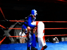 two wrestlers are fighting in a ring with a referee in the background