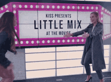 a sign that says kiss presents little mix at the movies