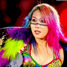 a woman with rainbow hair is wearing a colorful outfit and has the hashtag #thenextbigthing on her face