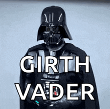a man in a darth vader costume stands in front of a white background