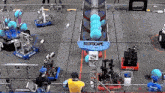 a group of robots are playing a game with a sign that says ' reefscape ' on it