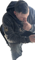 a man wearing a hoodie that says ' air force ' on the sleeve