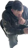 a man wearing a hoodie that says ' air force ' on the sleeve