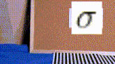 a cork board with a picture of the letter t on it