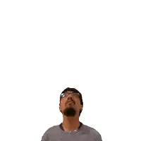 a man with a beard and glasses is looking up at the number 21