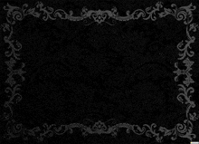a black background with silver swirls and leaves on it