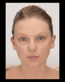 a close up of a woman 's face without makeup on .