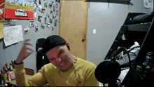 a man in a room with a sign that says super mario bros.