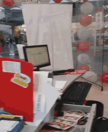 a desk with a computer and a keyboard with a sticker on it that says ' snoopy ' on it