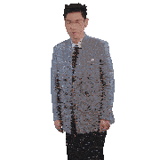 a man in a suit and tie is dancing with his hands in the air