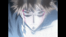 a close up of a person 's face with blood coming out of his eyes
