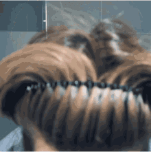 a close up of a person 's hair with braces in it