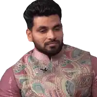 a man with a beard is wearing a paisley vest and a pink shirt