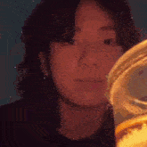 a close up of a person 's face with a blurred background