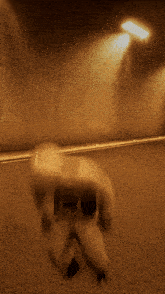 a blurry image of a person in a tunnel with a light on
