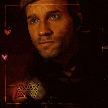 a picture of a man in a suit and tie with stardust canon written on the bottom