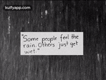 a black and white photo with a quote on it that says `` some people feel the rain . others just get wet . ''