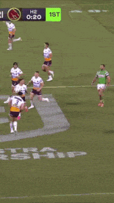 a group of rugby players are playing a game and the time is 3:18