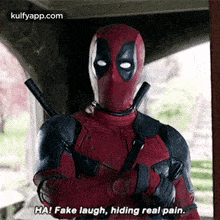 deadpool is standing with his arms crossed and saying `` fake laugh , hiding real pain '' .