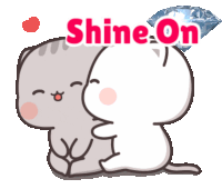 a sticker of two cats with the words shine on on it