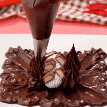 a white plate topped with chocolate frosting and candy