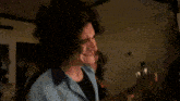 a close up of a person 's face with a blurred background