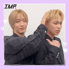 two men are standing next to each other and the word imp is on the bottom