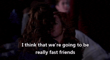 two women are hugging each other in a dark room and they are talking about being really fast friends .