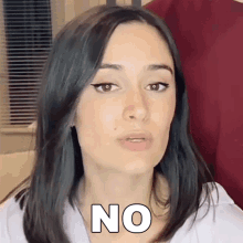 a woman is making a face and says no