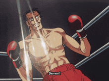 a shirtless boxer in a boxing ring with the words seven below him