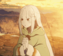 a girl with long white hair is wearing a green hoodie