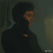 a man is talking on a cell phone and says where are you netflix