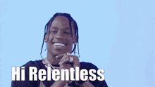 a man with dreadlocks is smiling with the words hi relentless below him .