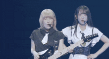 a woman playing a guitar with a yamaha logo on the neck