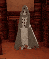 a cardboard cutout of a woman with a hood is standing in front of a pile of books