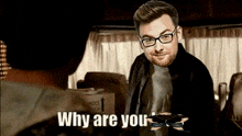 a man with glasses is talking to another man with the words " why are you " written below him