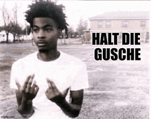 a black and white photo of a man with the words halt die gusche written on the bottom
