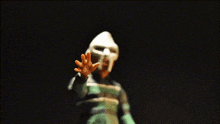 a blurry picture of a person wearing a white mask