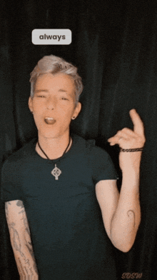 a person with a tattoo on their arm and a sticker that says always on it