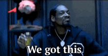 snoop dogg is holding a glass of beer and saying `` we got this '' .