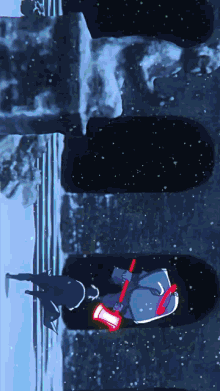 a person laying in the snow with a red light