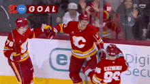 a hockey player with the number 96 on his jersey is celebrating with his teammates