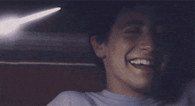 a close up of a man 's face smiling