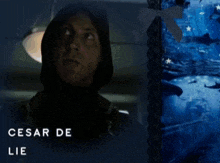 a poster of a man holding a gun with the name cesar de lie below him