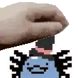 a person 's hand is reaching for a pixelated cartoon character with a hat .