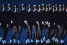 a row of women in black dresses and white socks