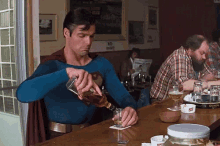 Drink And Fly GIF - Superman Drinking At The Bar GIFs