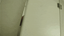 a person 's foot is visible in a mirror