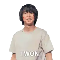a man with blood on his face is wearing a white shirt that says " i won "